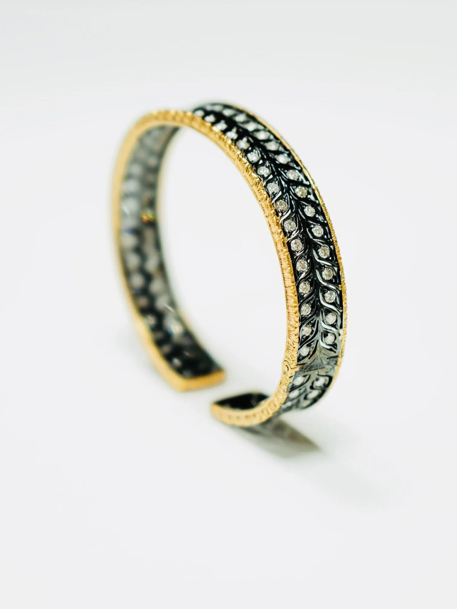 Black, gold, and diamond bracelet