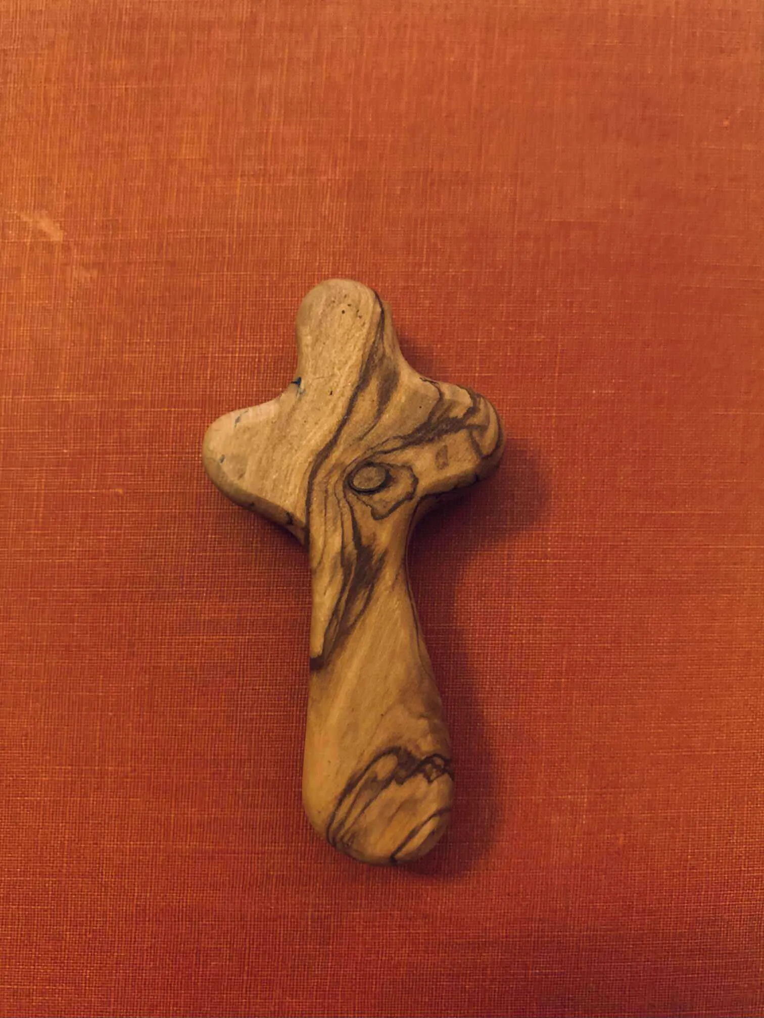 Wooden Cross With A Red Background