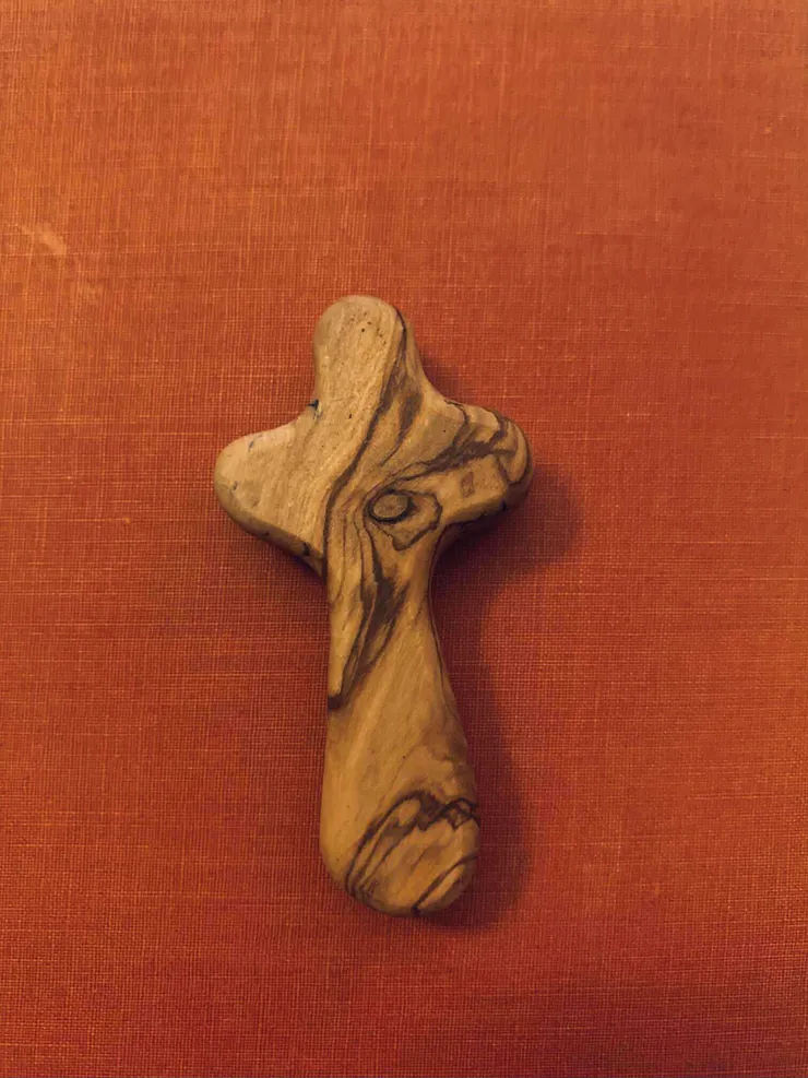 Wooden Cross With A Red Background